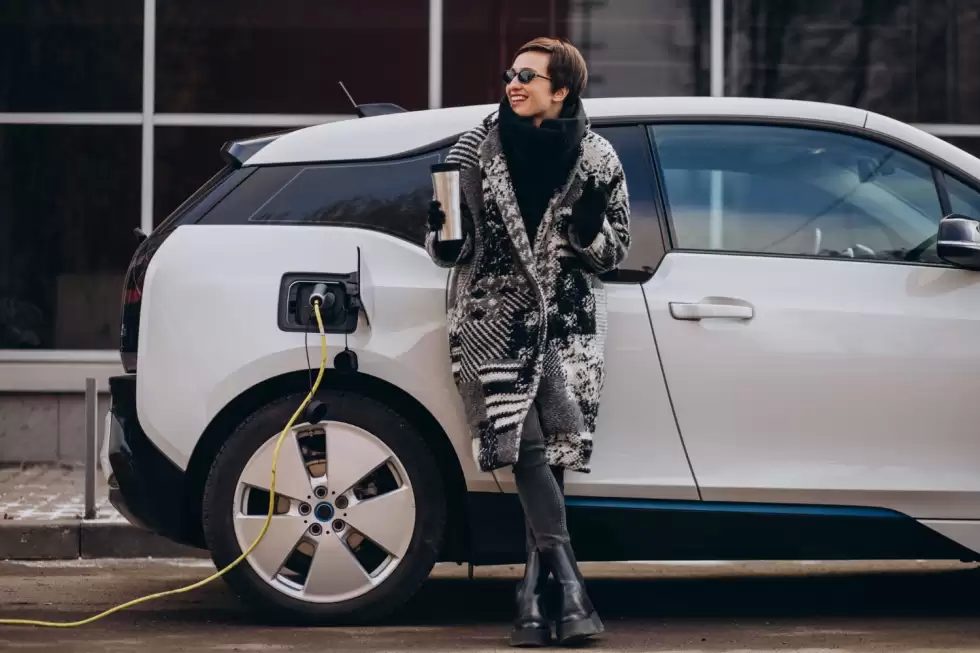 woman-charging-electro-car-street
