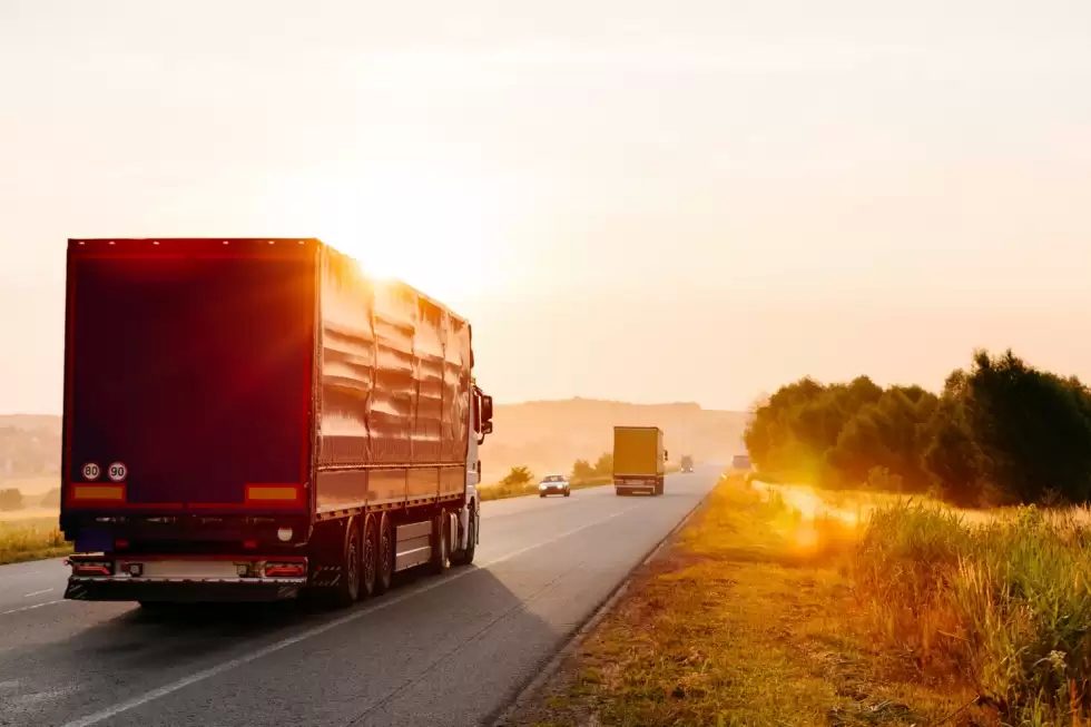 arriving-truck-road-rural-landscape-sunset