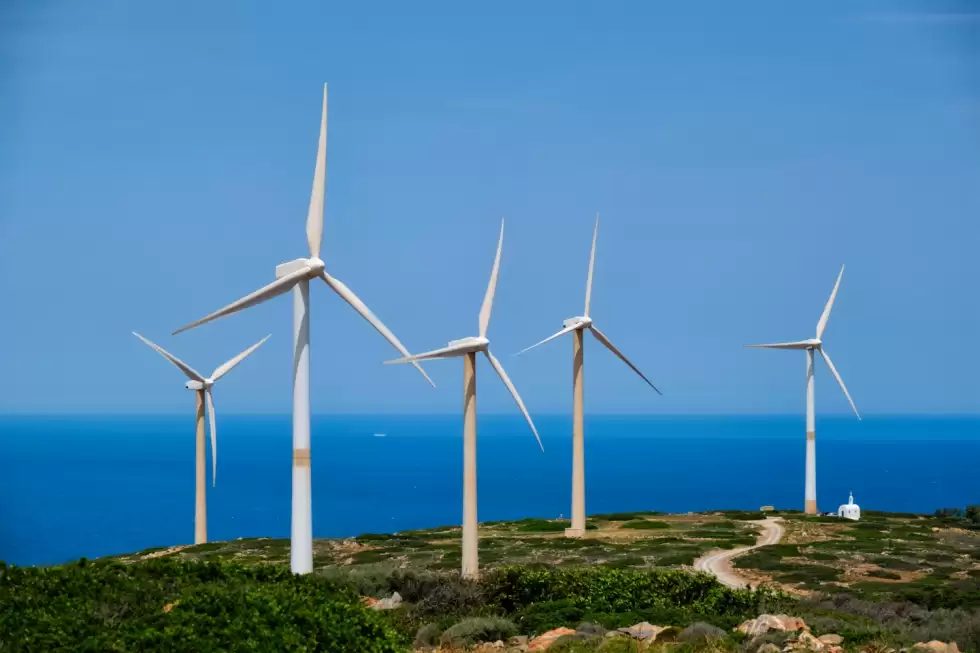 green-renewable-alternative-energy-concept-wind-generator-turbines-generating-electricity-wind-farm-crete-island-greece-with-small-white-church