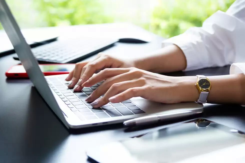 female-hand-typing-keyboard-laptop-1