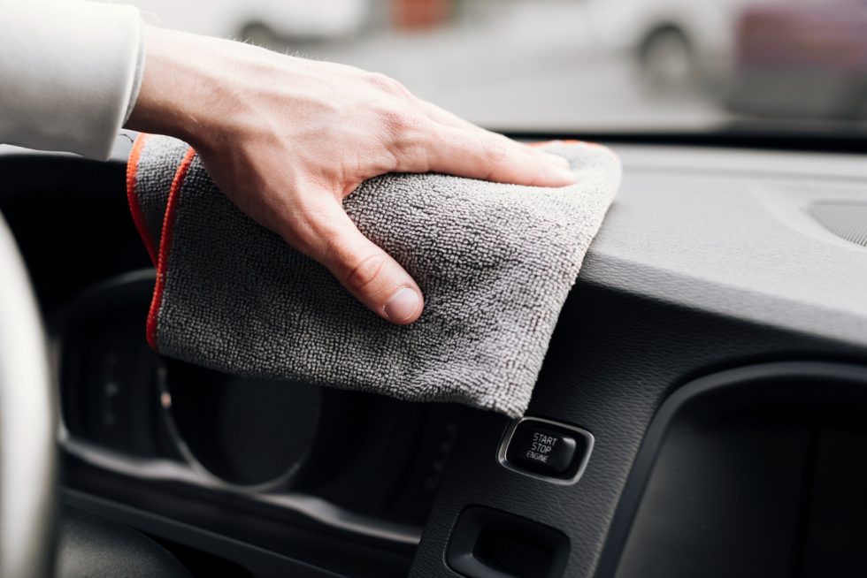 close-up-person-cleaning-car-interior